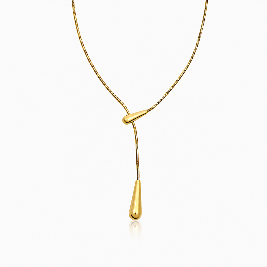 Gold-tone Y-shaped lariat necklace with a delicate chain, polished teardrop slider, and elongated teardrop pendant.
azzaik.com